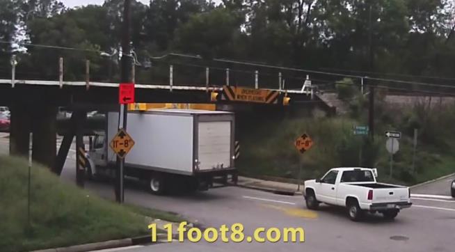 People Can't Stop Watching Trucks Crash Into This Bridge