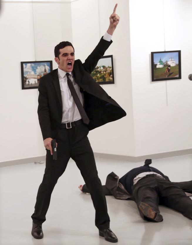 Assassin's Defiant Stance Is World Press Photo of the Year
