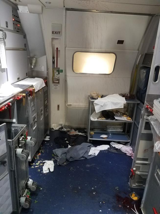 Flight Attendant Broke Wine Bottle Over Unruly Passenger's Head