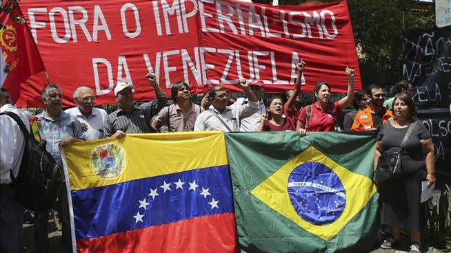 Maduro’s Forces Kill, Injure Protestors as Standoff Over Aid in Venezuela Escalates