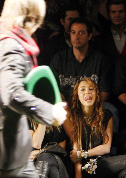 Mmmm... Miley Flirts as Beau Models