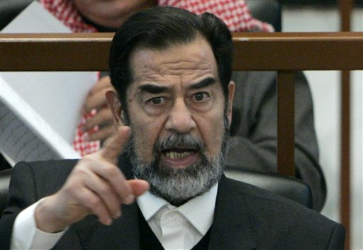 Saddam Stabbed After Death: Guard