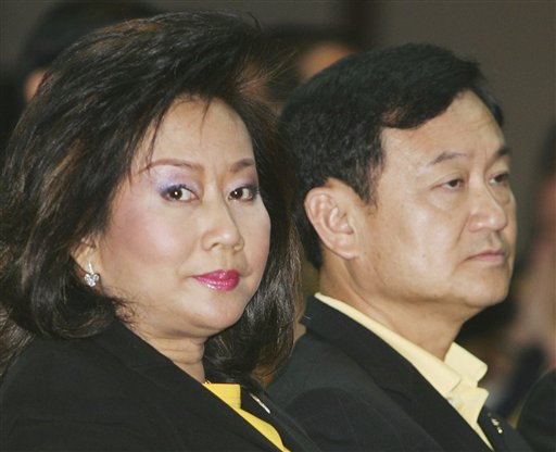 Fugitive Thai PM Divorces