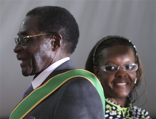 Mugabe's Wife Pounds Photog