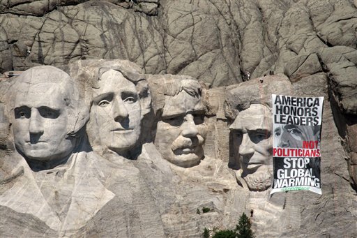 Protesters Hang Banner on Rushmore