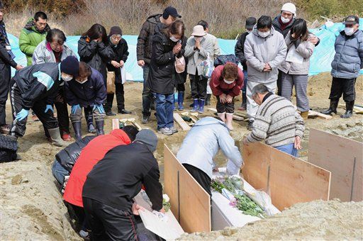 Japan Resorts to Mass Graves