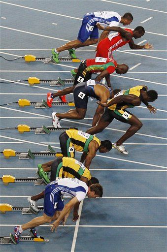 Usain Bolt Disqualified for False Start; 'Balderunner' Oscar Pistorius Advances to Semis in Men's 400 Meter