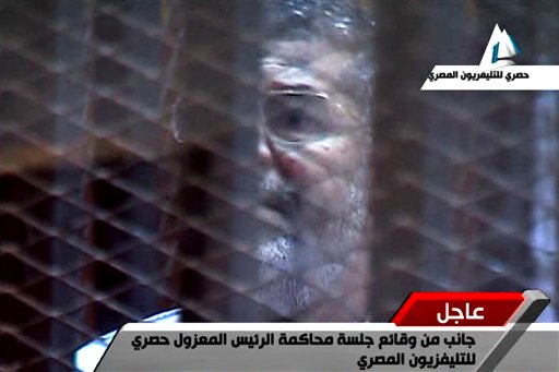 At New Trial's Start, Morsi Shouts—in Soundproof Cage