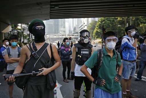 Hong Kong Cops Take Down Protest Barricades