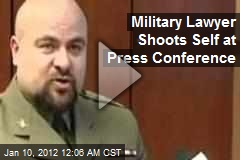 Military Lawyer Shoots Self at Press Conference