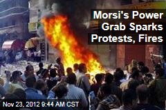 Morsi&#39;s Power Grab Sparks Protests, Fires
