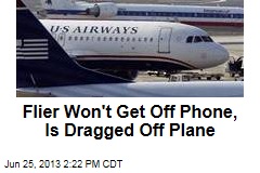 Flier Won&#39;t Get Off Phone, Is Dragged Off Plane
