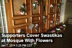 Supporters Cover Swastikas at Mosque With Flowers