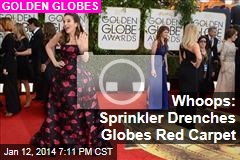 Whoops: Sprinkler Drenches Globes Red Carpet