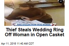 Thief Steals Wedding Ring Off Woman in Open Casket