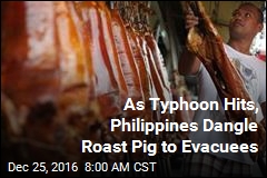 As Typhoon Hits, Philippines Dangle Roast Pig to Evacuees