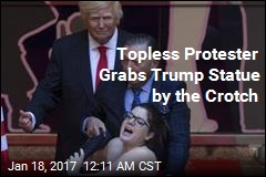 Topless Protester Grabs Trump Statue&#39;s Crotch