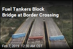 Troops Barricade Bridge With Fuel Tankers