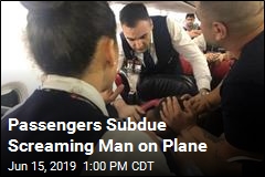Passengers Subdue Screaming Man on Plane