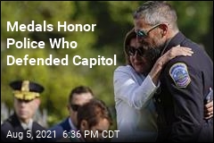 Biden Signs Bill Honoring Police for Capitol Defense