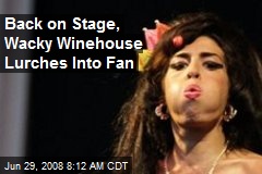 Back on Stage, Wacky Winehouse Lurches Into Fan