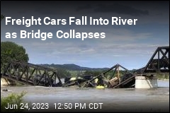 Freight Cars Fall Into River as Bridge Collapses