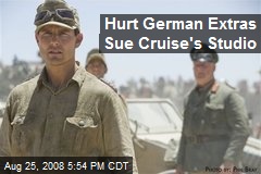 Hurt German Extras Sue Cruise's Studio