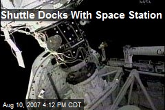 Shuttle Docks With Space Station