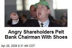 Angry Shareholders Pelt Bank Chairman With Shoes