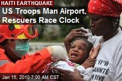 US Troops Man Airport, Rescuers Race Clock