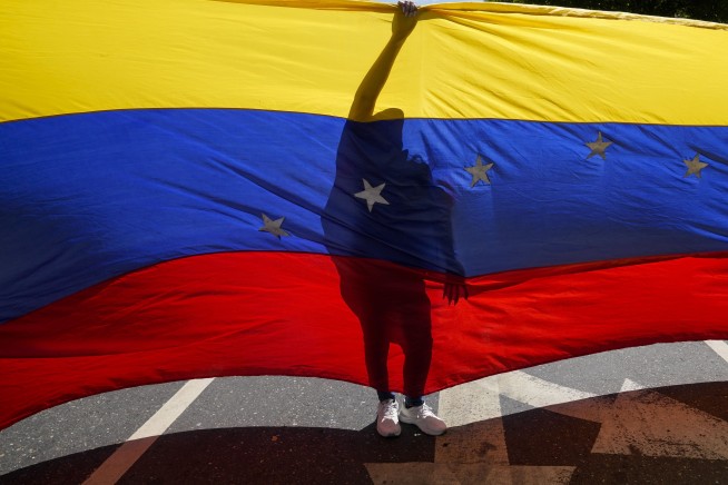 Venezuela's opposition leader defies Maduro to lead protests that end in confusing arrest claims