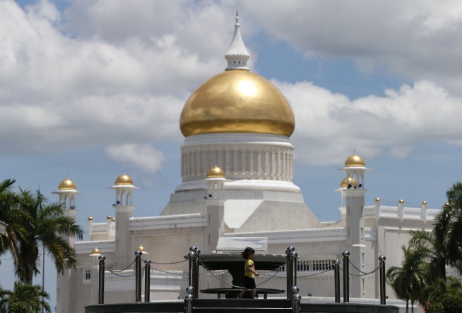 Brunei invokes laws allowing stoning for gay sex, adultery