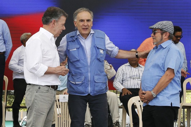 Colombia takes big step to peace as rebels lay down guns