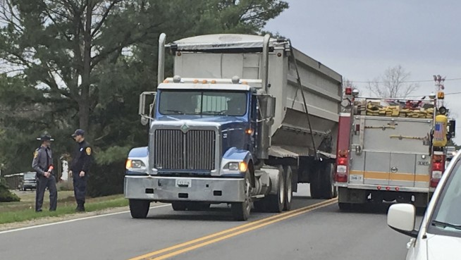 Truck carrying mulch hits, kills 2 children near bus stop