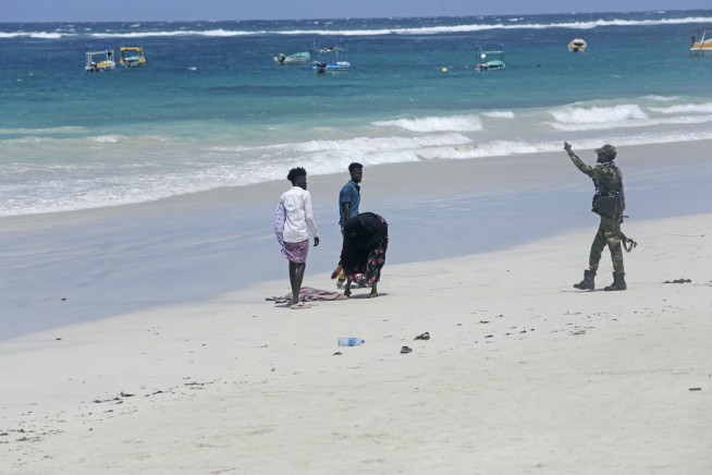 Somali police say 32 people died in an attack on a beach hotel. Al-Shabab claimed responsibility.