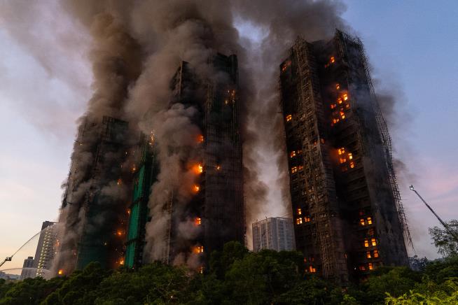 3 arrested in Hong Kong, as a high-rise fire leaves at least 44 dead and 279 reported missing