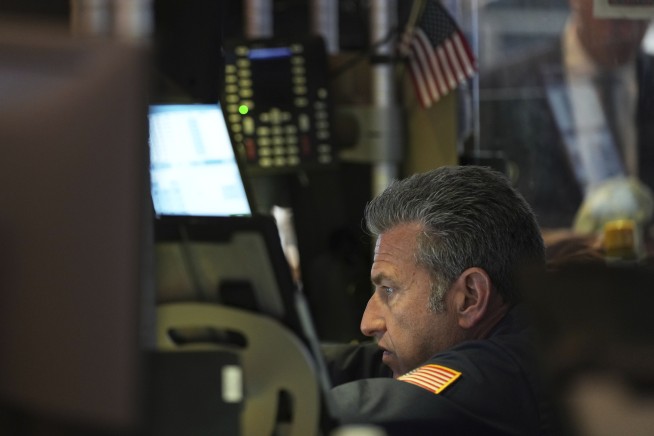 US stocks dip after careening through a manic day following Trump's latest tariff threat