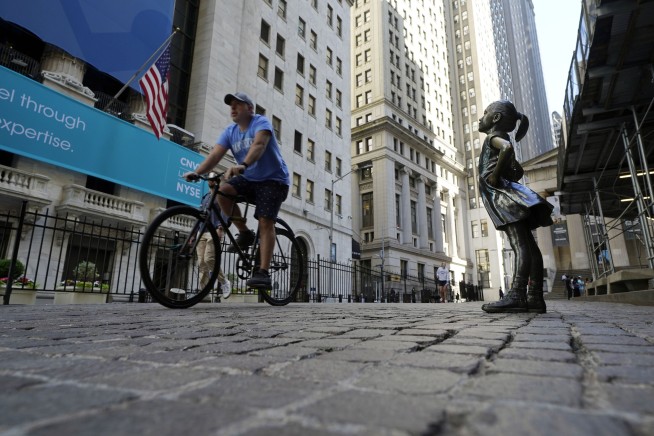 Stocks dip, yields rise as Fed hints at dialing back support