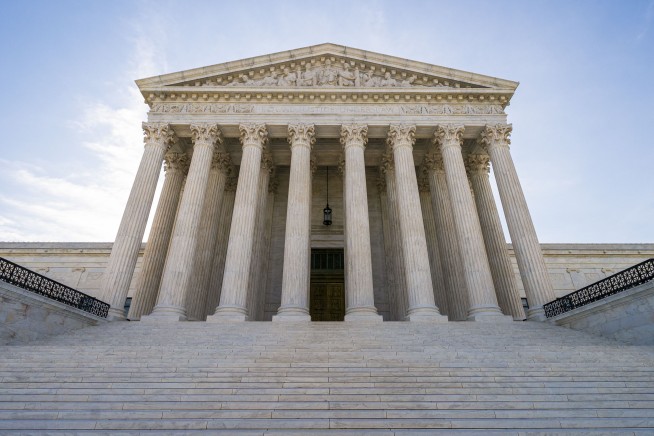 Justices allow enforcement of new green card rule