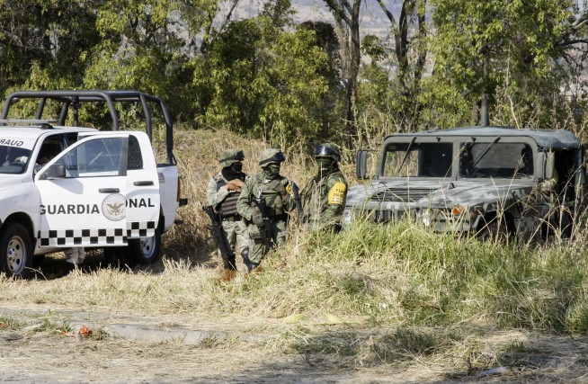 Searchers find 59 bodies in Mexico mass graves, dig for more