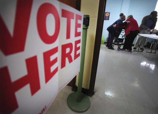 Tornadoes, virus fears, machines disrupt some voting