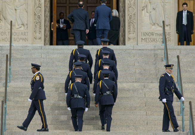 The Latest: Scalia's son remembers his father at Mass