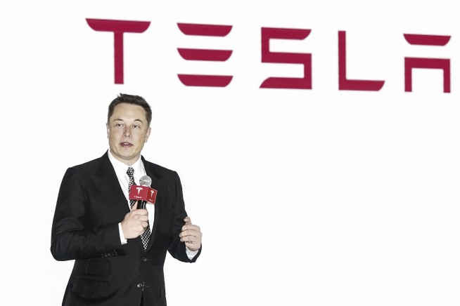 Activists urge Tesla to close new Xinjiang showroom
