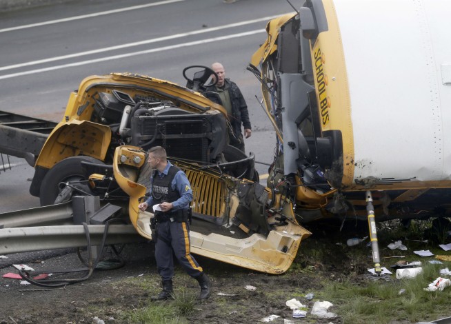 School bus ripped apart in dump truck crash, killing 2