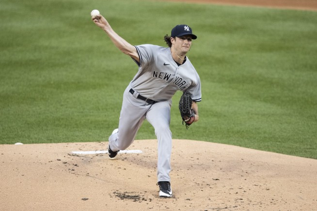 Cole, Stanton lead Yanks past Nats 4-1 in stormy MLB opener