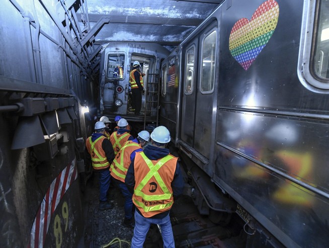 New York City subway train derails in collision with another train, injuring more than 20 people