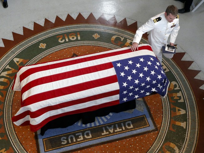 Sen. John McCain's family cries over flag-draped casket
