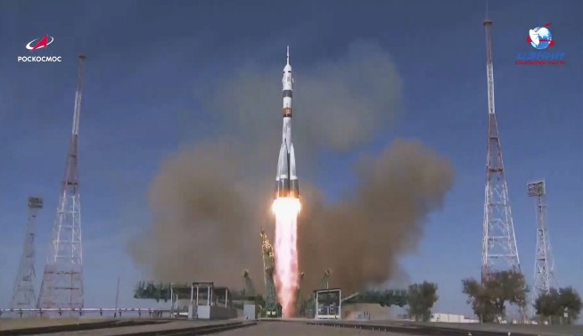 Russian-US crew welcomed aboard the space station