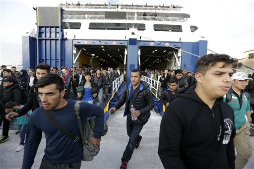 The Latest: 2 dead, 47 migrants rescued off Greek island