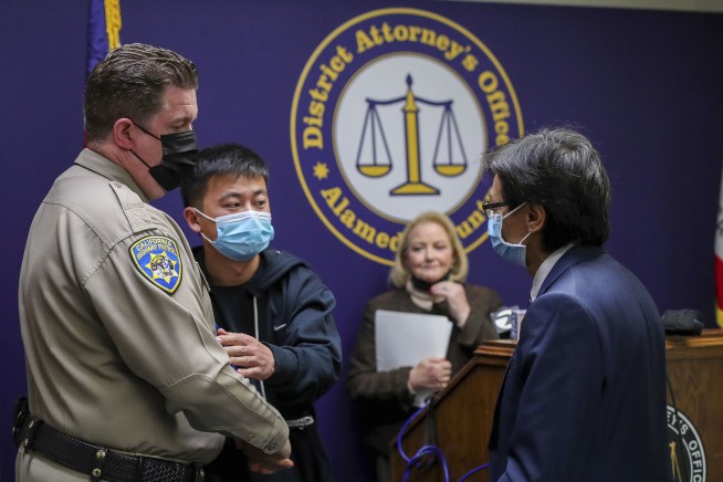 3 charged in toddler's slaying in California gang gun battle